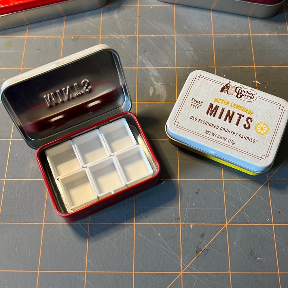 Mini watercolor travel palette in tin.